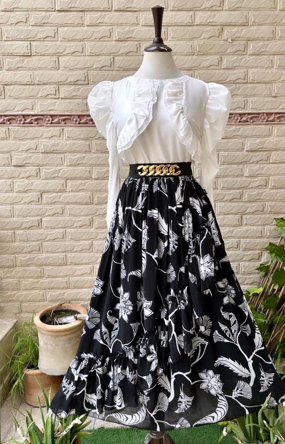 Stylish two-piece chiffon outfit with frill details and waist belt