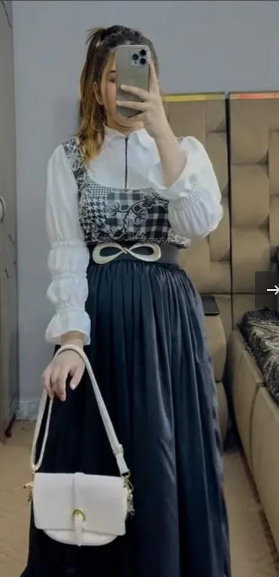 Model wearing full Black Checkered Skirt Set with white shirt – front view
