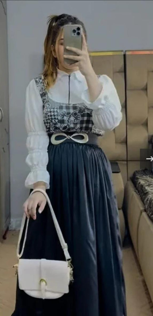 Model wearing full Black Checkered Skirt Set with white shirt – front view
